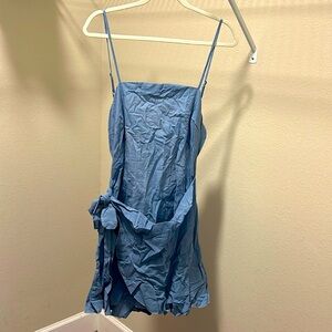 New in bag SHEIN romper. Open tie back. Denim blue color. Lightweight. Size XL.